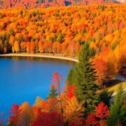 Autumn landscape with colorful leaves and tranquil lake.