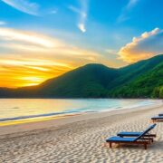 Scenic beach with hills and colorful sunset.